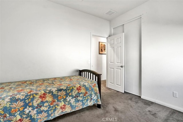 carpeted bedroom with baseboards and visible vents