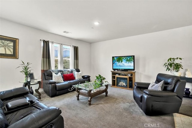living room featuring light colored carpet and visible vents