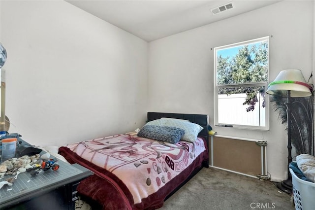bedroom featuring carpet floors and visible vents