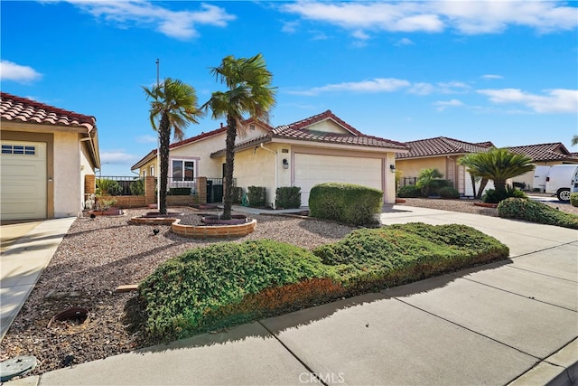 mediterranean / spanish-style home featuring a garage