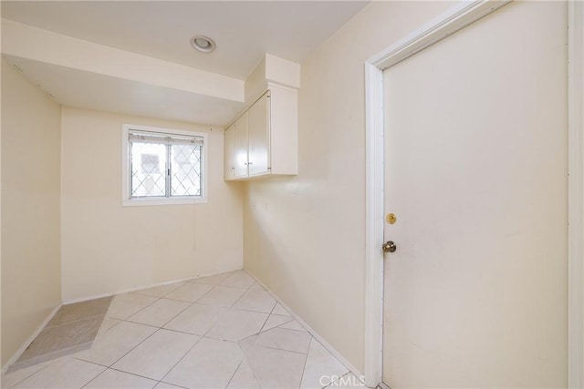 laundry room with light tile patterned floors