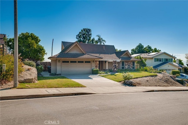 view of front of property with a front yard and a garage