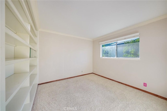 carpeted spare room with ornamental molding