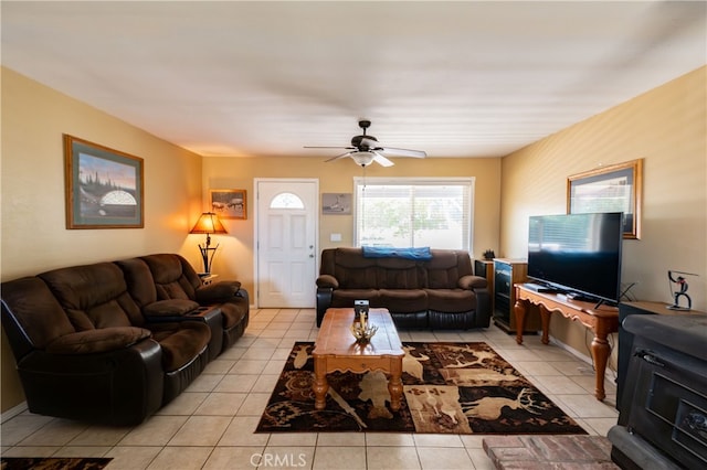 tiled living room with ceiling fan