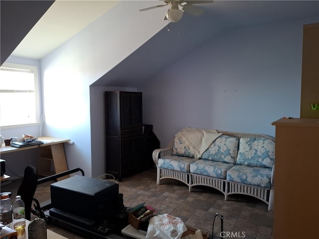 living room featuring vaulted ceiling and ceiling fan