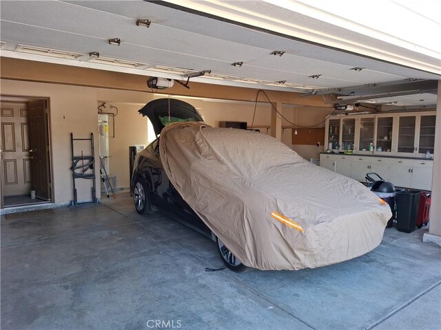 garage featuring a garage door opener