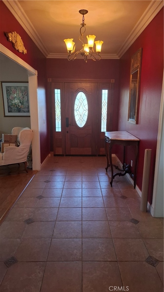 tiled entryway with crown molding, a chandelier, and plenty of natural light