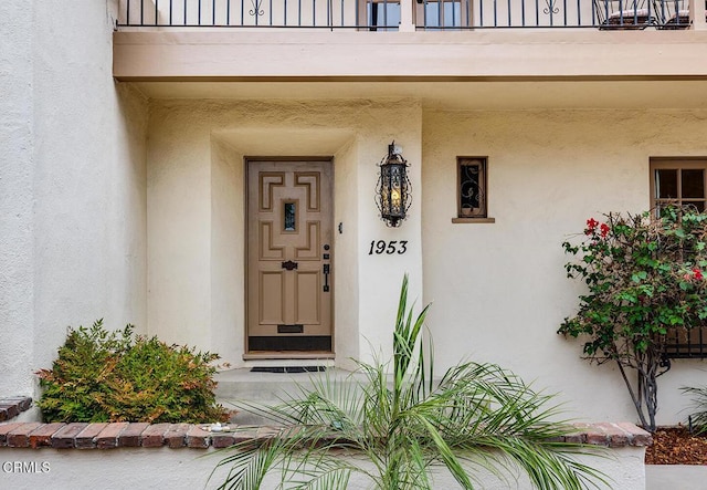 doorway to property featuring a balcony