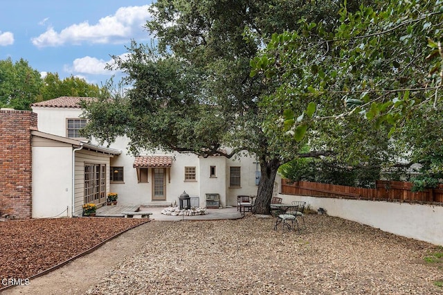 back of property with a patio area