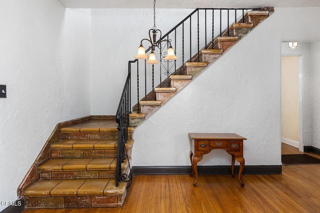 staircase featuring hardwood / wood-style floors