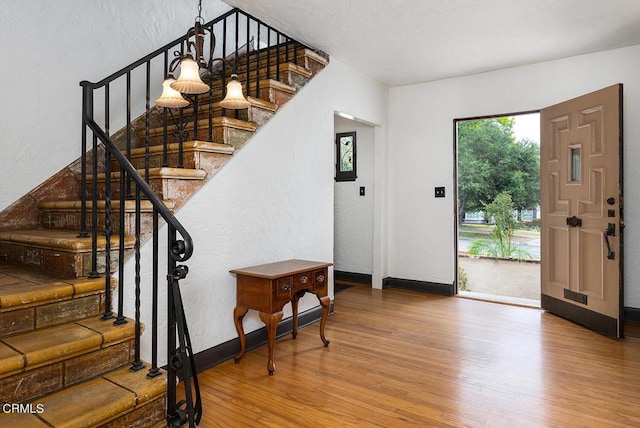 foyer entrance featuring hardwood / wood-style floors