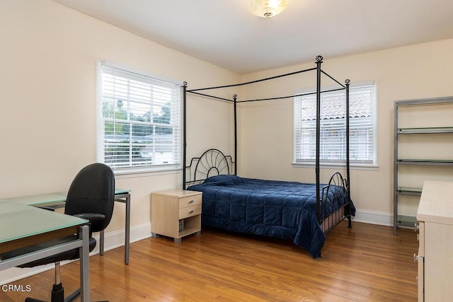 bedroom featuring wood-type flooring