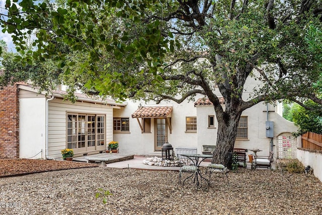 back of house featuring a patio area