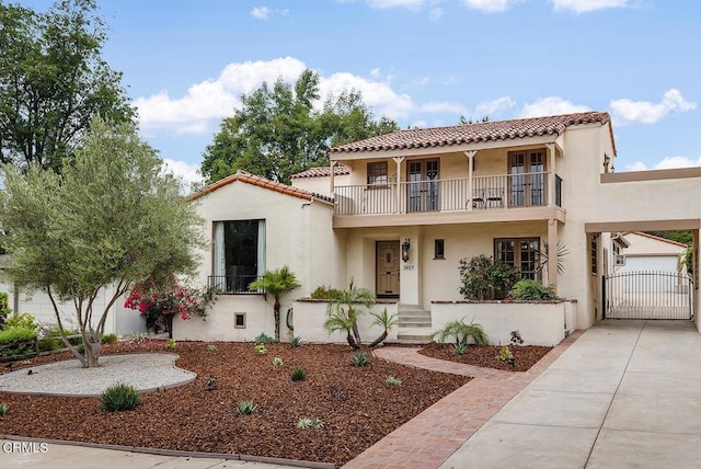 mediterranean / spanish-style house with a balcony