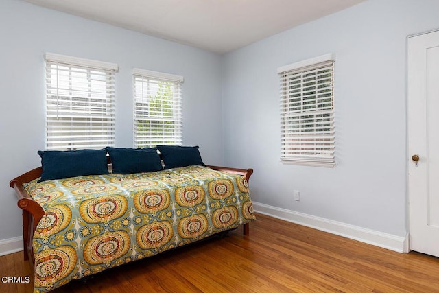 bedroom with hardwood / wood-style floors