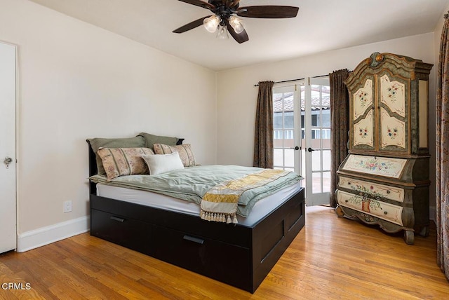 bedroom with ceiling fan, light wood-type flooring, and access to outside