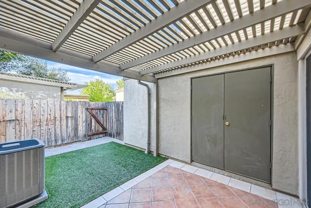 view of patio featuring a pergola and central AC unit