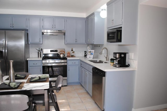 kitchen featuring light tile patterned floors, sink, and appliances with stainless steel finishes