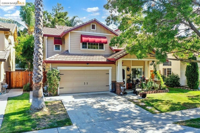 craftsman house featuring a porch, a garage, and a front yard