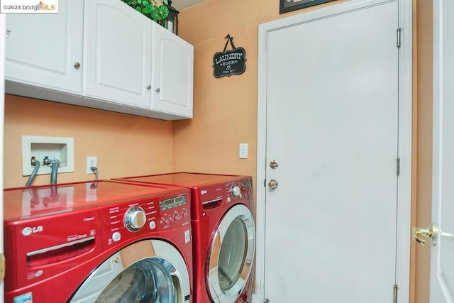 clothes washing area with independent washer and dryer and cabinets