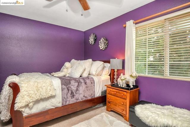 carpeted bedroom featuring ceiling fan