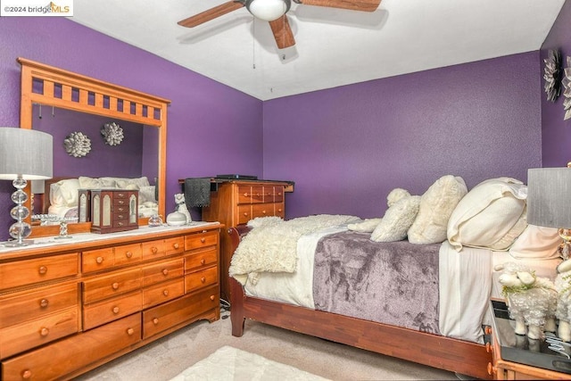 carpeted bedroom featuring ceiling fan