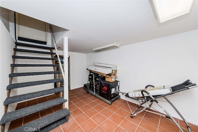 interior space with a wall unit AC and tile patterned flooring