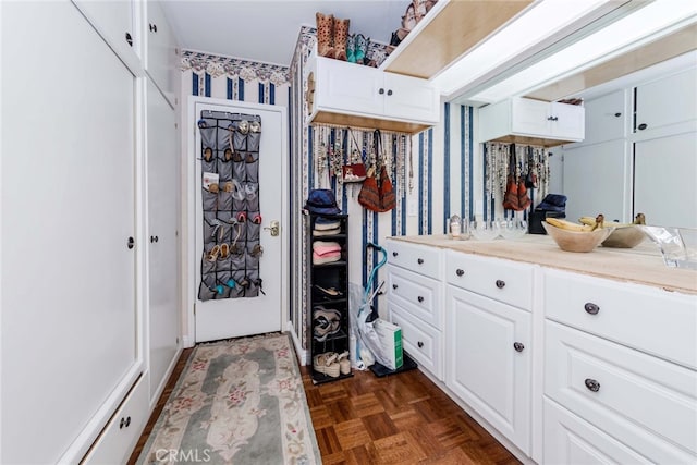 interior space featuring parquet flooring and vanity