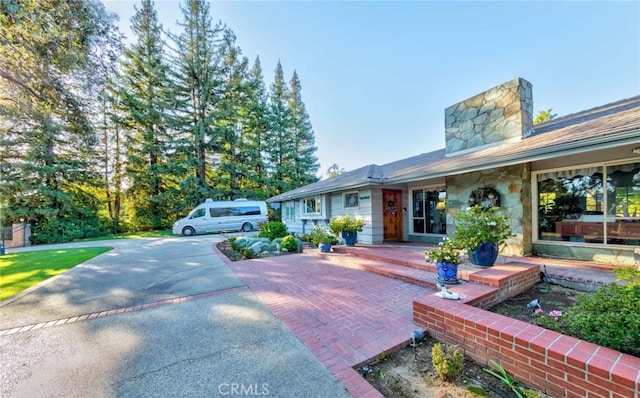 645 W Foothill Blvd, Arcadia, CA 91006 - view of front facade with a chimney and stone siding