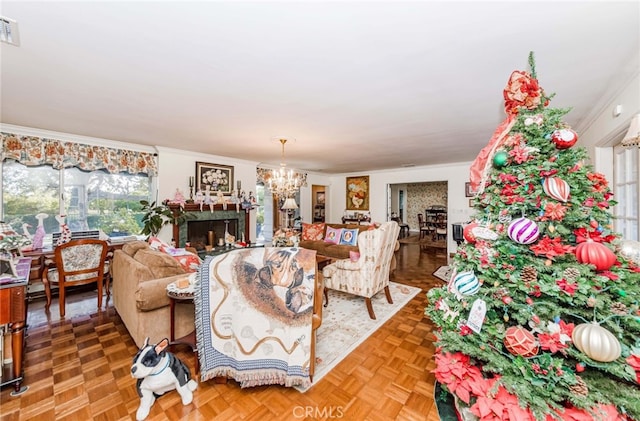 living room featuring parquet flooring, crown molding, and a notable chandelier