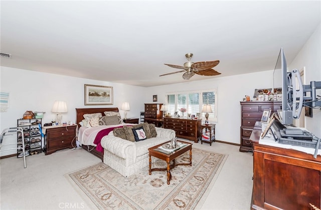 bedroom featuring light carpet and ceiling fan