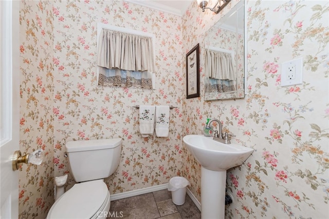 bathroom with sink, crown molding, toilet, and tile patterned flooring