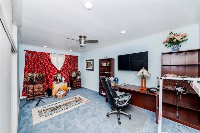 carpeted office featuring crown molding and ceiling fan