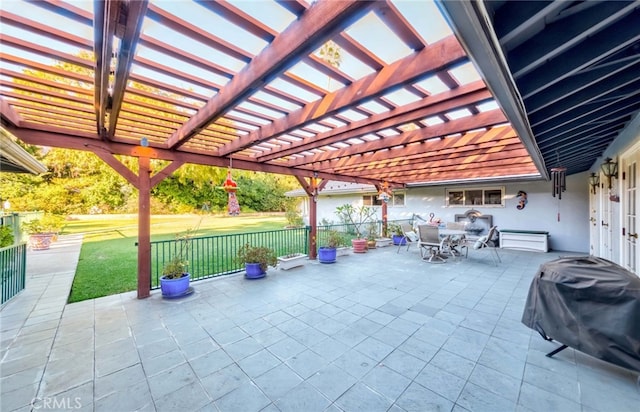 view of patio featuring grilling area and a pergola