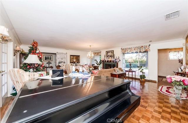 kitchen featuring light parquet flooring, ornamental molding, an inviting chandelier, and white cabinets