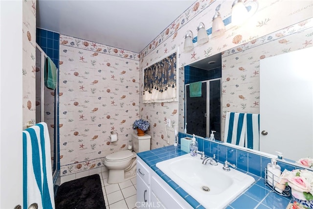 bathroom featuring vanity, a shower with shower door, toilet, and tile patterned flooring