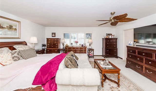 bedroom with light colored carpet and ceiling fan