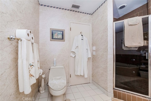 bathroom featuring a shower with door, toilet, tile patterned floors, and lofted ceiling