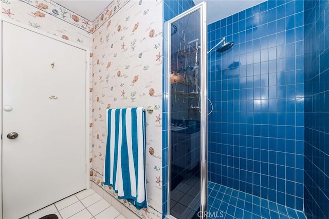 bathroom featuring tile patterned floors and an enclosed shower