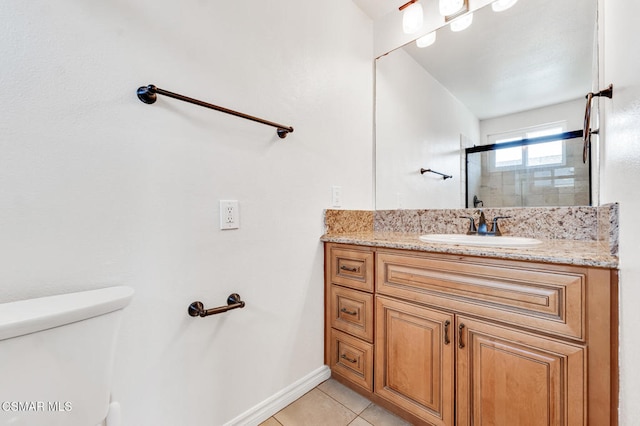 bathroom featuring a shower with door, toilet, tile patterned flooring, and vanity