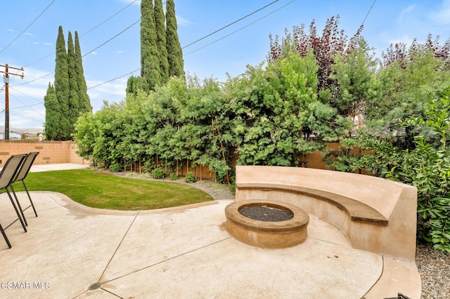 view of patio / terrace with a fire pit