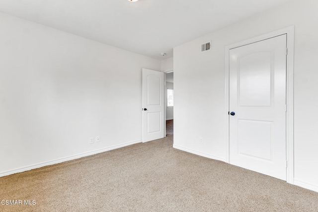 unfurnished bedroom featuring carpet