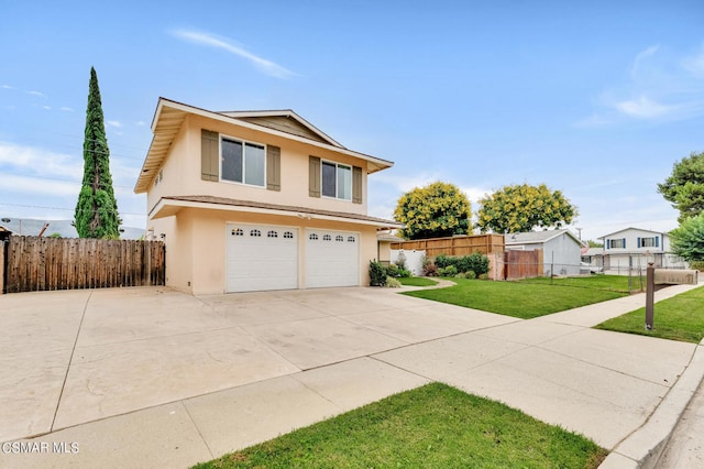 view of front property with a garage and a front lawn