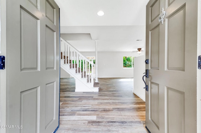 entrance foyer featuring light wood-type flooring and ceiling fan