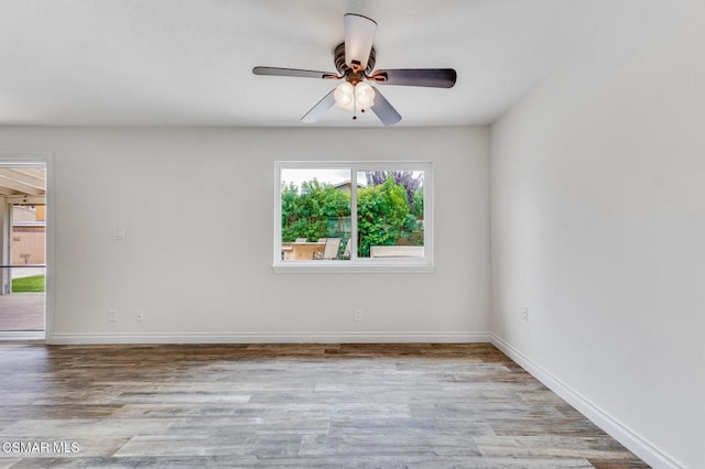 unfurnished room with light wood-type flooring and ceiling fan