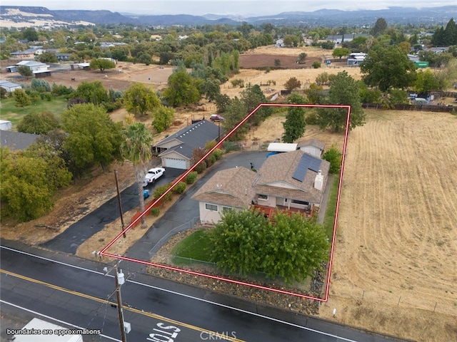 drone / aerial view featuring a mountain view