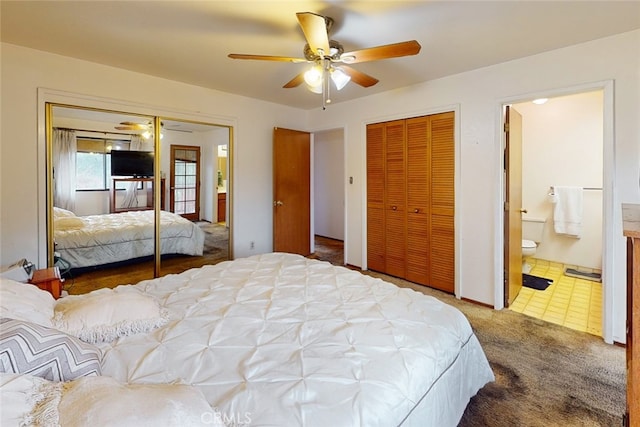 carpeted bedroom featuring ensuite bath and ceiling fan