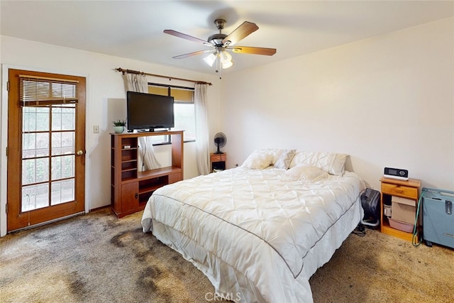 carpeted bedroom with multiple windows and ceiling fan