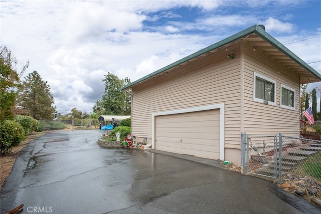 view of side of home with a garage