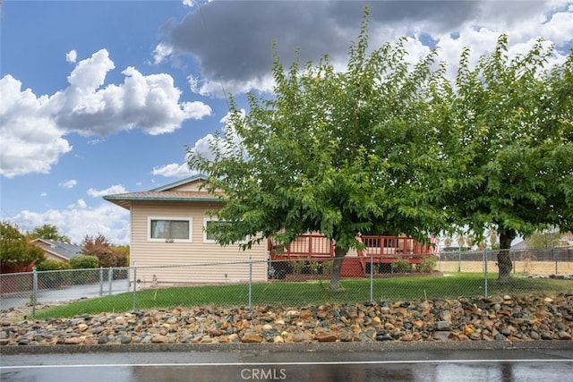 view of property exterior featuring a wooden deck